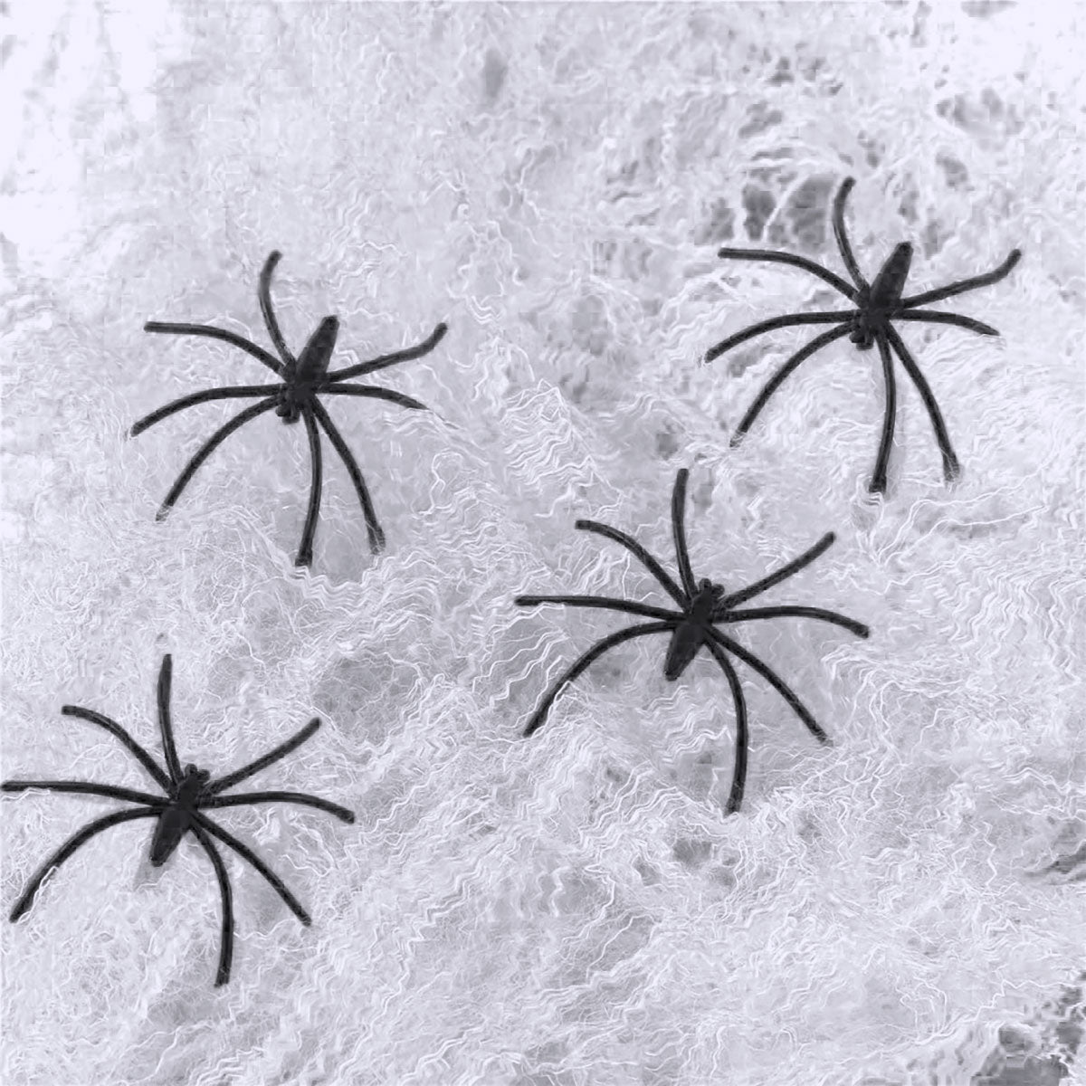 Telaraña Fluorescente con 4 Arañas de Plástico