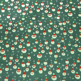 Papel de Regalo Navideño color Verde con Estampado de Santa Claus